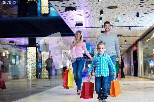 Image of young family with shopping bags