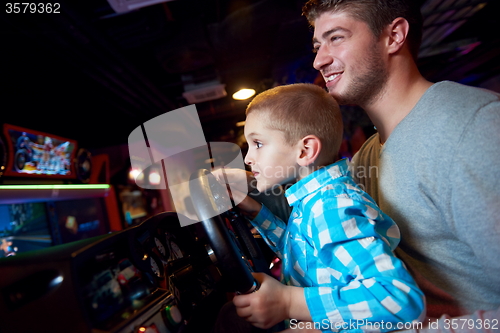 Image of father and son playing game in playground