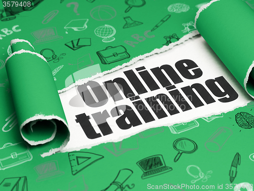 Image of Studying concept: black text Online Training under the piece of  torn paper