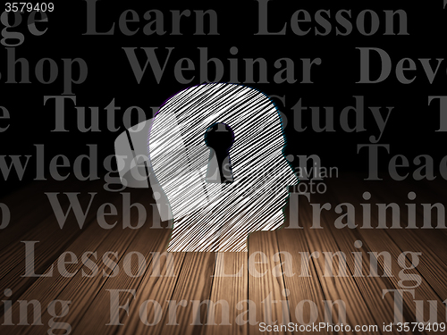 Image of Education concept: Head With Keyhole in grunge dark room
