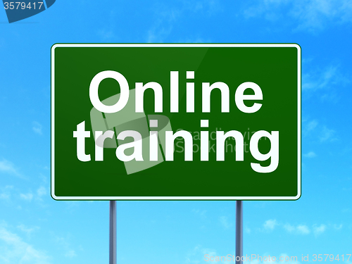 Image of Education concept: Online Training on road sign background