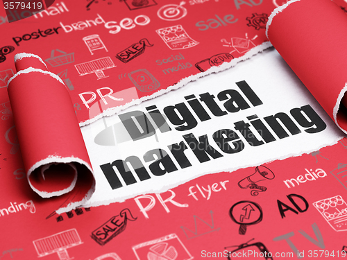 Image of Marketing concept: black text Digital Marketing under the piece of  torn paper