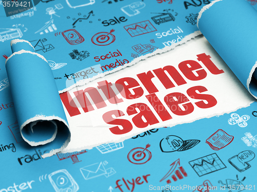 Image of Marketing concept: red text Internet Sales under the piece of  torn paper