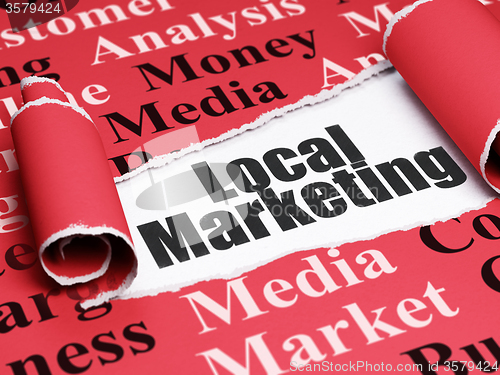 Image of Marketing concept: black text Local Marketing under the piece of  torn paper