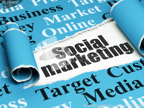 Image of Advertising concept: black text Social Marketing under the piece of  torn paper