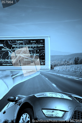 Image of GPS Vehicle navigation system in a man hand.