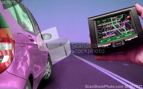 Image of GPS Vehicle navigation system in a man hand.