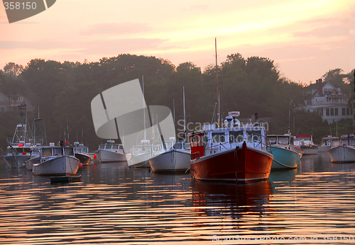 Image of Fishing boats at sunset