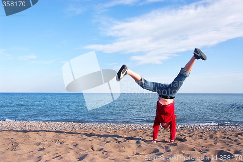 Image of Girl doing cartwheel