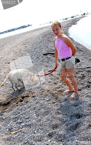 Image of Girl walking dog