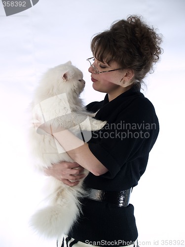 Image of Young Lady in glasses holding cat