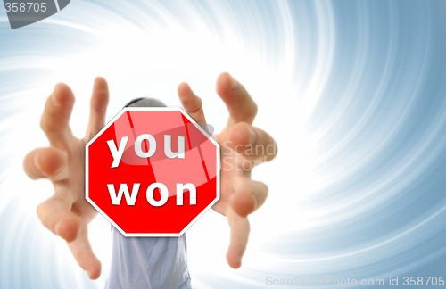 Image of Man grabing a red sign.