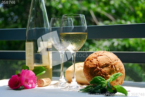 Image of White wine with glasses outside