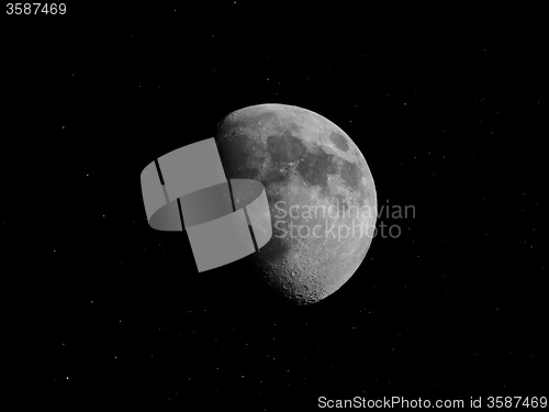 Image of Black and white Gibbous moon with stars