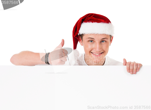 Image of Young man in Santa hat