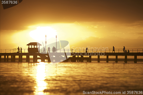 Image of Sunset setting over pier