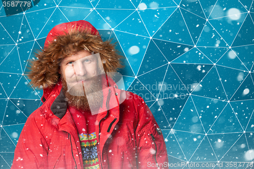 Image of Handsome man in winter snow