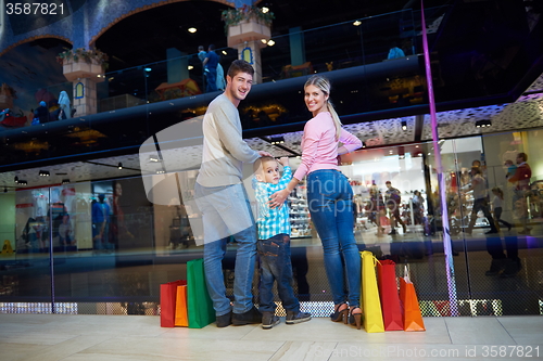 Image of young family with shopping bags