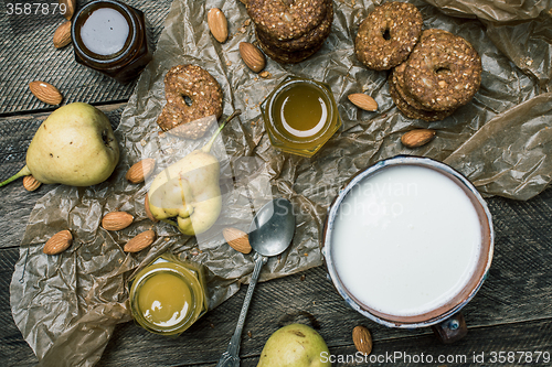 Image of Cookies pears honey and yoghurt on wooden table