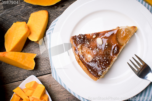 Image of Lunch piece of pie Pumpkin slices in Rustic style