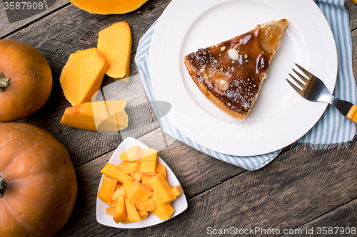 Image of Pumpkin slices and piece of pie in Rustic style