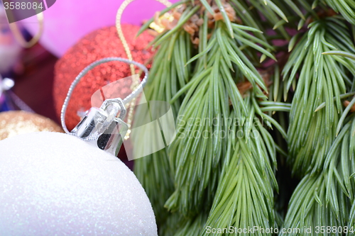 Image of Closeup of beautiful Christmas baubles, Decorated christmas tree, holiday background, green tree eve branch close up with christmas balls 