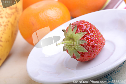 Image of strawberry, mandarin, orange, banana, many different fruits for the health of the entire family