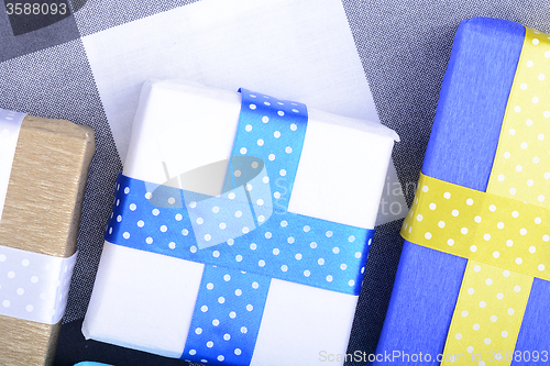 Image of bright gifts with ribbons, holiday invitation card