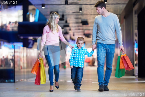 Image of young family with shopping bags