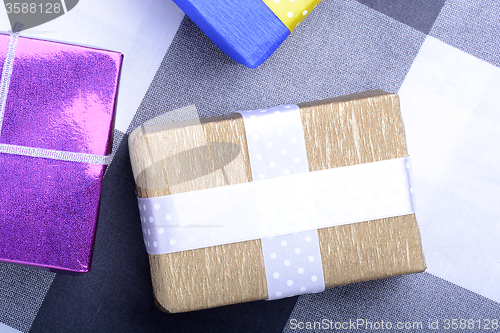 Image of bright gifts with ribbons, holiday invitation card