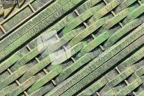 Image of Green metal texture with patches of rust steel on its surface, taken outdoor