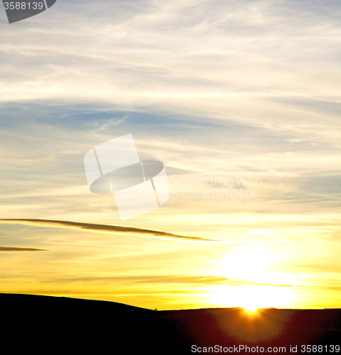 Image of sunrise in the colored sky white soft clouds and abstract backgr