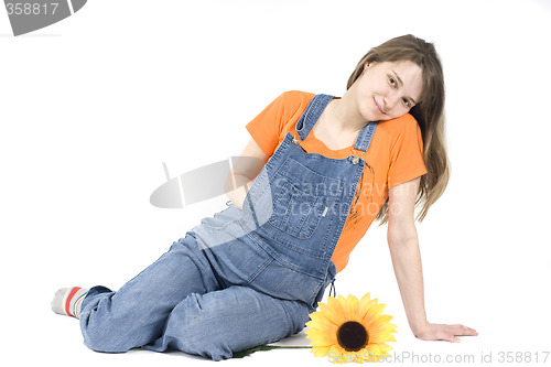 Image of Portrait of a happy pregnant woman with sunflower