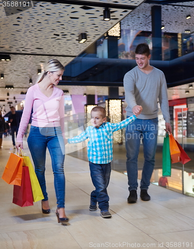 Image of young family with shopping bags
