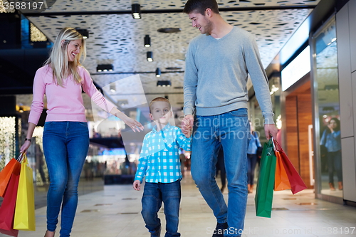 Image of young family with shopping bags