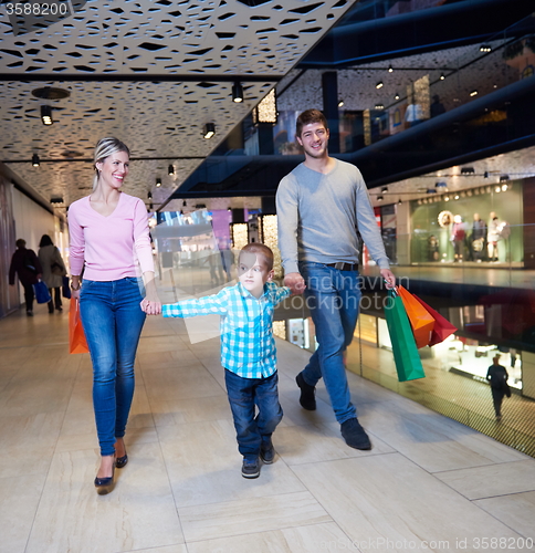 Image of young family with shopping bags