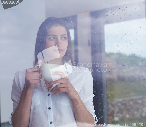 Image of beautiful young woman drink first morning coffee