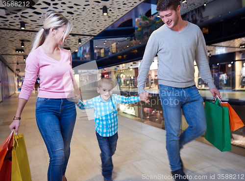 Image of young family with shopping bags