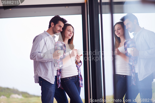 Image of relaxet young couple drink first morning coffee