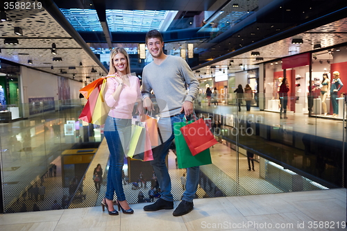 Image of young couple with shipping bags