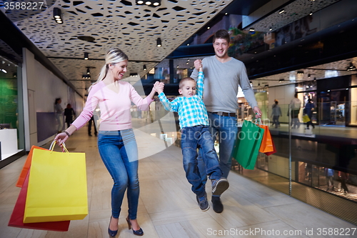 Image of young family with shopping bags