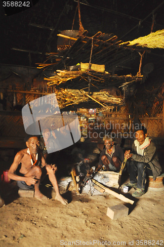 Image of Men around fire in Nagaland, India