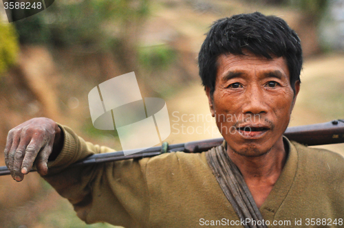 Image of Man with rifle in Nagaland, India