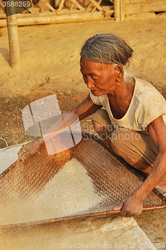 Image of Old woman sifting in Nagaland, India