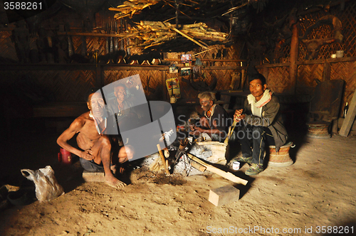 Image of Men around fire in Nagaland, India