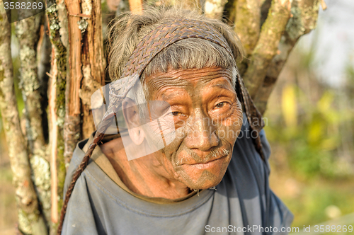 Image of Old man carrying load in Nagaland, India