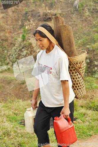 Image of Young woman carrying load in Nagaland, India