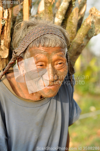 Image of Old man carrying load in Nagaland, India