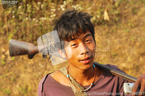 Image of Young man with rifle in Nagaland, India