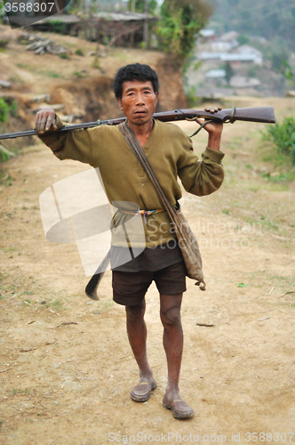 Image of Man with rifle in Nagaland, India